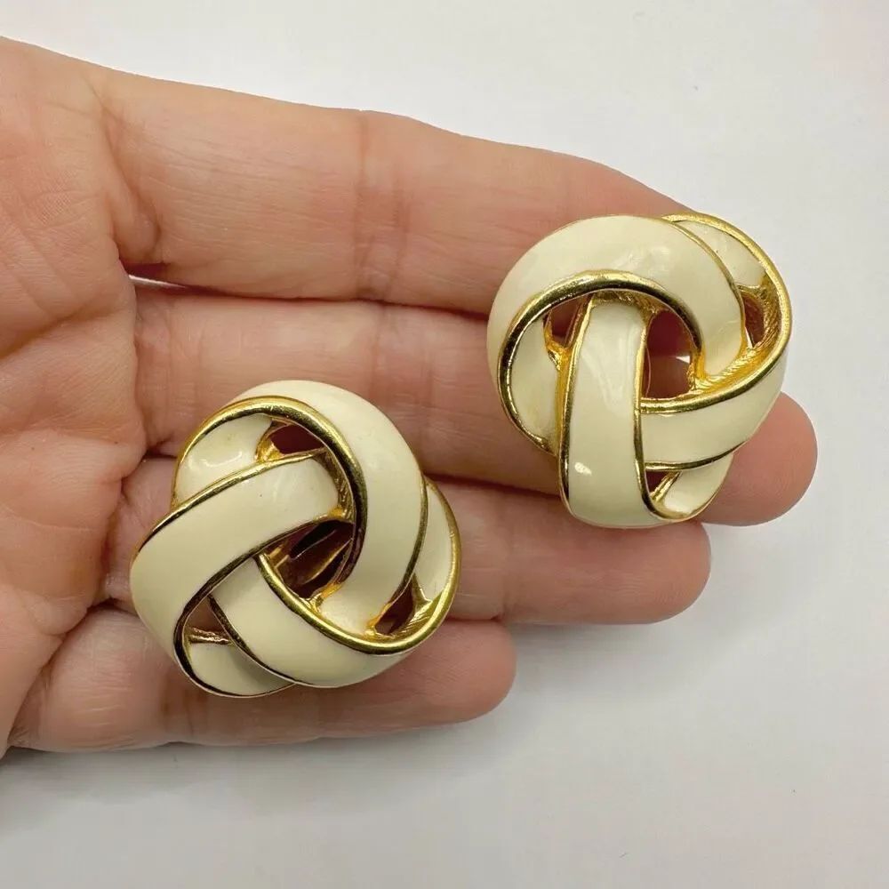 Vintage clip on cream and gold tone knot earrings
